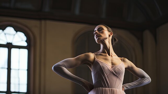 Model demonstrating a ballet position, emphasizing muscle definition, set in a classic ballet studio