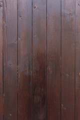 Naklejka premium Brown vertical wooden background