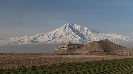 Panoramic view of biblical Mount Ararat at sunrise with ancient Armenian monastery Khor Virap
