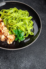 green pasta red tomato sauce tagliatelle ready to eat chicken meat vegetable food meal snack on the table copy space food background rustic top view