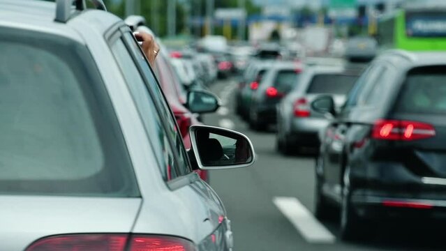 Large queue of vehicles on motorway pay toll in summer