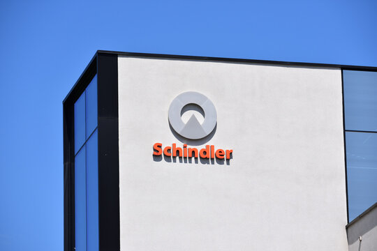 Schindler Group signage, emblem, logo, sign on the facade. Elevator manufacturer company. WARSAW, POLAND - JUNE 3, 2023