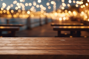 Wooden table and blur beach cafes background with bokeh lights. High quality photo - obrazy, fototapety, plakaty