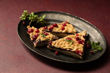 crumble with lingonberry jam on a vintage tray