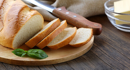 white loaf of bread sliced on a board