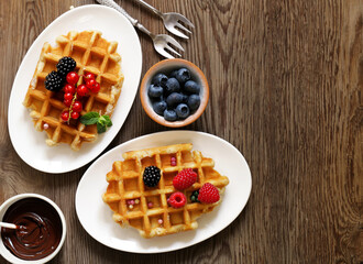 sweet waffles with berries for breakfast