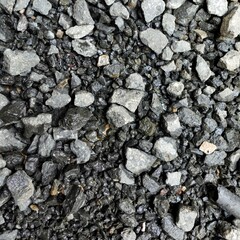 Expanse of gravel with a uniform composition of blackish color