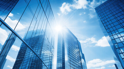 Fototapeta na wymiar Glass buildings with cloudy blue sky background