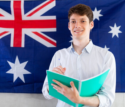 Relocation, immigration and study abroad concept - positive student on Australia flag background