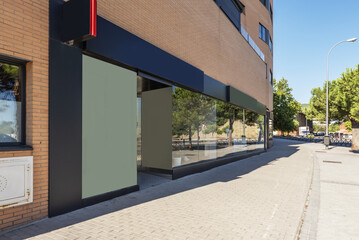 Image of a modern commercial premises at the foot of a wide street