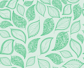 Beautiful vector seamless pattern with handwritten figured green leaves 