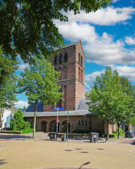Oisterwijk, Netherlands (North Brabant) - July 9. 2023: Beautiful church tower in dutch town