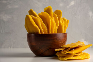 Dried mango fruit on gray background. No added suger healthy snack.