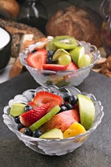 Fruitful Elegance: 4K Close-Up of Sliced Fresh Mixed Fruits in a Glass Bowl