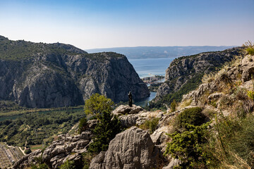 Fototapeta na wymiar Captivating View from Mountains – town Omiš in Croatia, Cetina River, Adriatic, and Brac Island