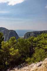 Naklejka premium Mountain View Over Omis, Cetina River, Adriatic Sea, and Brac Island