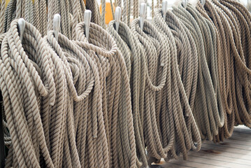 Ship ropes laid on the deck of a sailboat