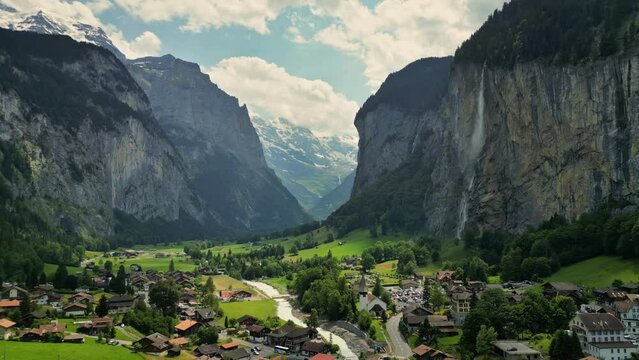 Fly over Swiss alpine village Lauterbrunnen. Aerial view of lauterbrunnen valley in Switzerland. Gorgeous mountains with glaciers, waterfalls and valley - nature of Swiss Alps