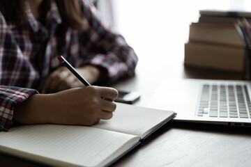 Asian woman student study online with skype teacher, happy young woman learn language listen...