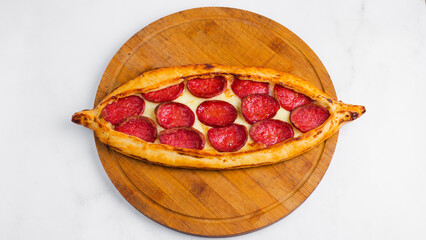 Turkish sausage pide top view on tray