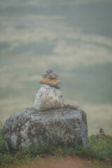 A Zen-style stone pyramid in a natural setting 