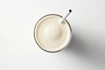  A top-down view of a vanilla milkshake sitting alone on a white background. © The Big L