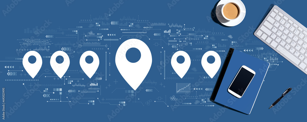 Aufkleber map pin concept with a computer keyboard and office items