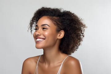 A portrait of a young African American woman with a captivating smile and radiant happiness