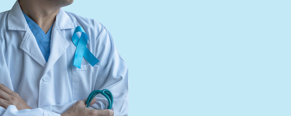 Blue ribbon for prostate cancer awareness, men's health care,  guillain-barre syndrome GBS concept with symbolic bow on doctor lab coat with blue copy space background - 643036422