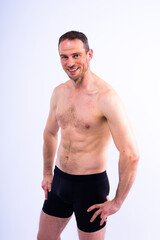 Fototapeta premium Portrait of man, bodybuilder and bicep flex in studio, background and exercise for muscular power.