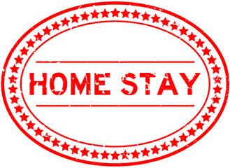 Grunge red home stay word oval rubber seal stamp on white background
