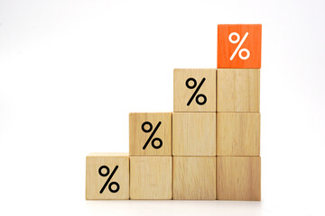 Wooden blocks with percentage sign. Interest rate finance, investment and interest rate increases.