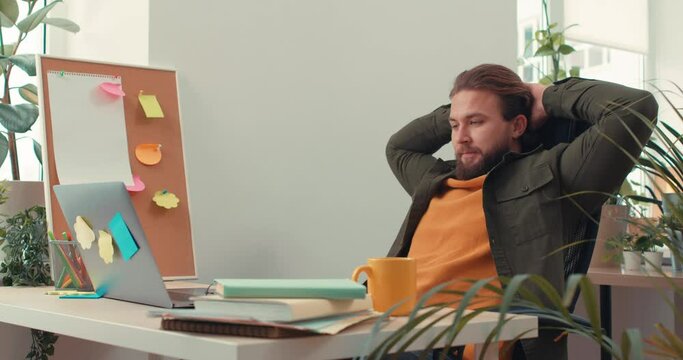 Happy calm relaxed Man Sitting at Workplace And Taking Break Bearded cheerful Relaxing In Office Lazy Businessman Leisure In Office Successful office worker has rest. Everything goes according to plan
