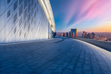 Empty floor and modern city skyline with building at sunset in Suzhou, Jiangsu Province, China....