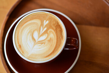 high angle view of coffee cup on wood grain table Drinking Concept: Hot Coffee, Latte, Espresso, Cappuccino