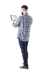 Rear side view of bearded business man pushing button on tablet computer blank touch screen. Full body isolated on transparent background.