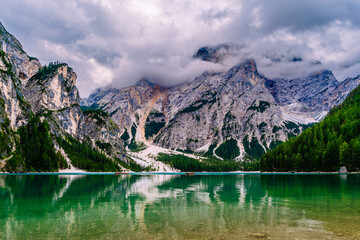 Fototapeta na wymiar Pragser Wildsee and Majestic Mountain Range in South Tyrol, Italy - Landscape Beauty