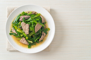 Stir-fried onion flower stem with pork liver