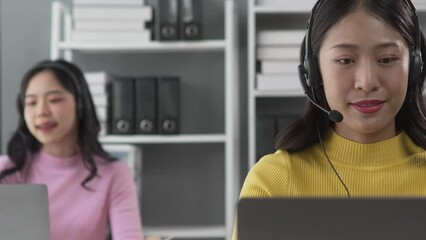 Telemarketing representative or sales agents sitting at workplace wearing headset use computer