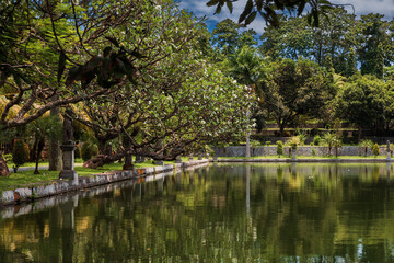 Fototapeta premium Water Palace Taman Ujung in Bali, Indonesia. Tropical park with pond in royal palace