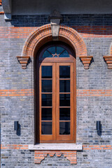 old window with brick wall