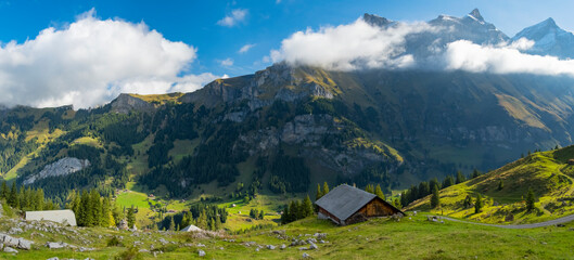 Fototapeta na wymiar Amazing touristic alpine village in valley, Switzerland attraction