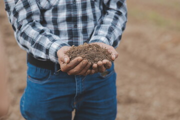 Symbol heart earth day. Handful of dirt hands heart shape. Farm organic earth. Farmer hands soil ground earth dirt garden soil farm ground. Male hands full of fertile land field agriculture concept