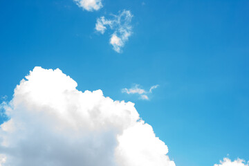 The vivid blue sky and the fluffy white cloud. Blue sky and cloud background.