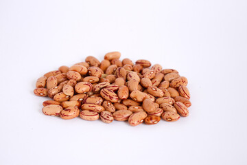 Red speckled beans on white background. Also known as a sugar bean