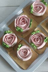 Homemade marshmallows. Zephyr flowers. On the tray. On white boards. Top view.