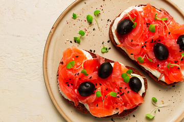 sandwiches with red fish, cream cheese, olives and microgreens, breakfast,