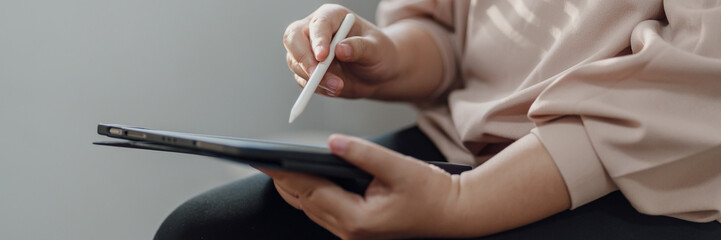 Creative designer using digital tablet creating artwork.