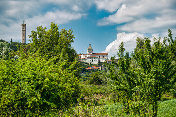 Panoramic view of the Church of Saint Andrew with the towering bell tower topped by an angel