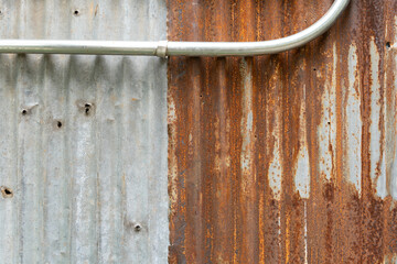 Industrial rusty background old grunge rusty zinc wall for textured background old rusty galvanized rust and scratched steel texture corrugated iron siding vintage background